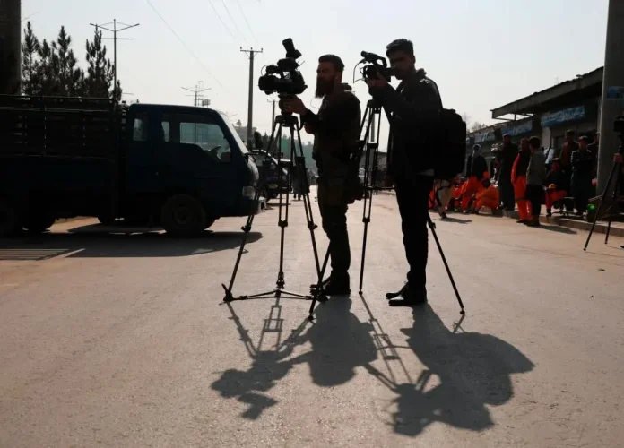 Afghan journalists film at the site of a bombing attack in Kabul, Afghanistan, Tuesday, Feb. 9, 2021. (Photo: 2021/AP Photo/Rahmat Gul/Human Right Watch/The Editor)