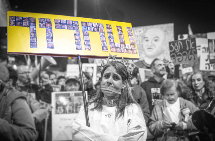 Demonstrators protest for the release of Israelis held hostage in the Gaza Strip, outside Hakirya Base in Tel Aviv, February 15, 2025 (PHOTO: MIRIAM ALSTER/THE JERUSALEM POST)