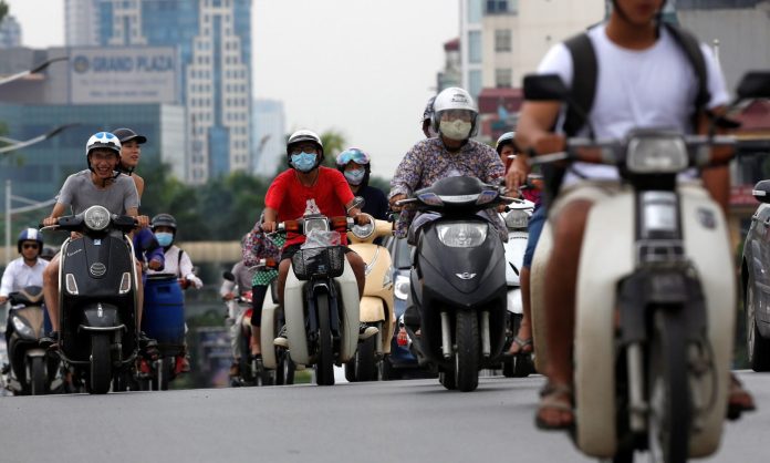 There are reportedly 4.9 million motorbikes and scooters on the streets of Hanoi (Photo: Kham/Reuters/THE EDITOR)