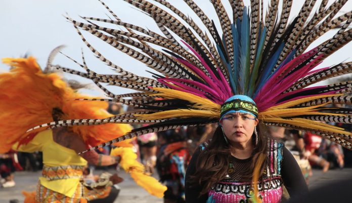 Indigenous dancers perform as part of ceremonies on Alcatraz Island on November 28, 2019 [Allison Griner/Al Jazeera/The Editor)