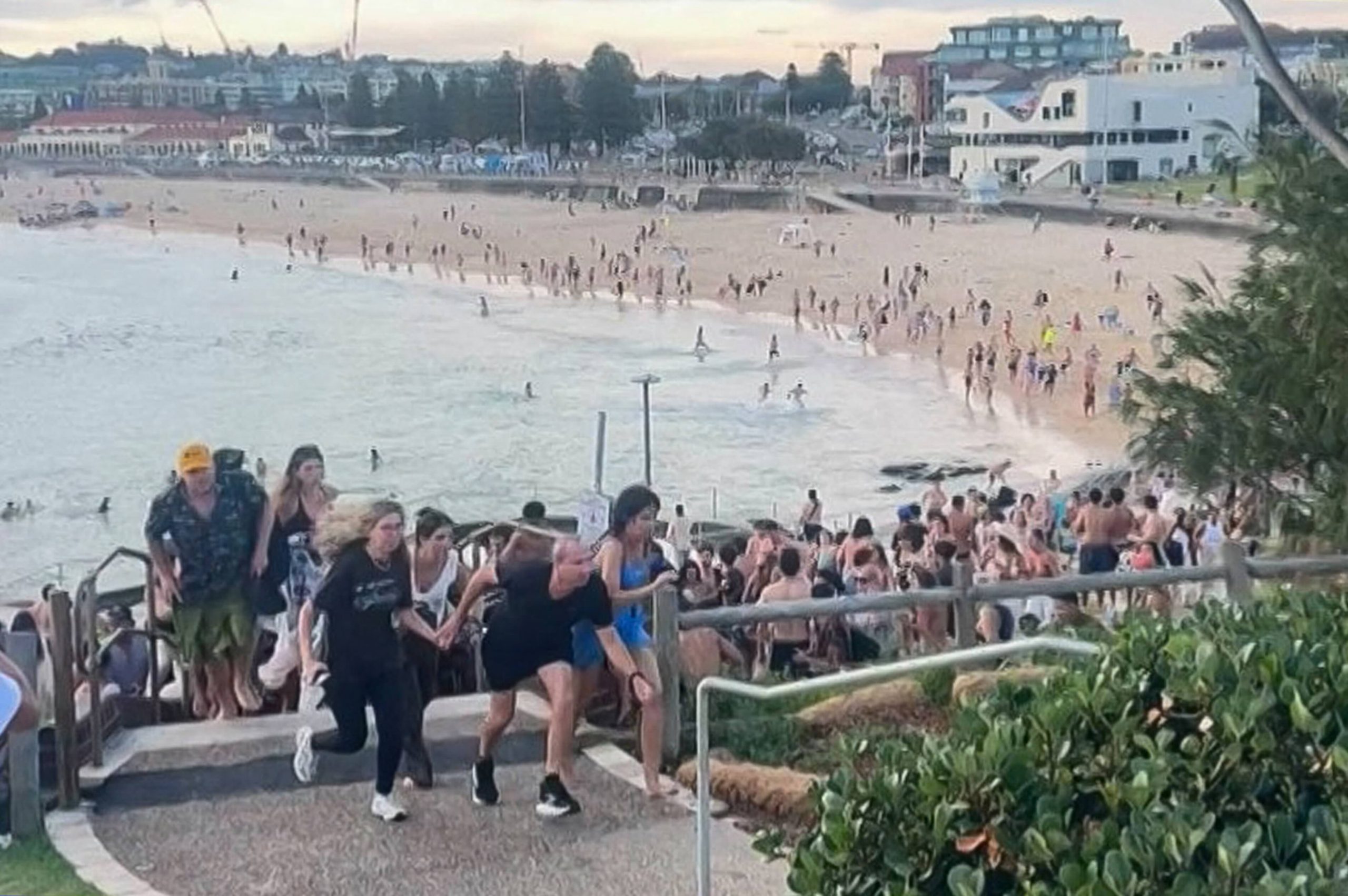 An image from a video received courtesy of Mike Ortiz showing beachgoers fleeing after the gunmen opened fire. (Photo: Mike Ortiz/UGC/AFP/Getty Images)