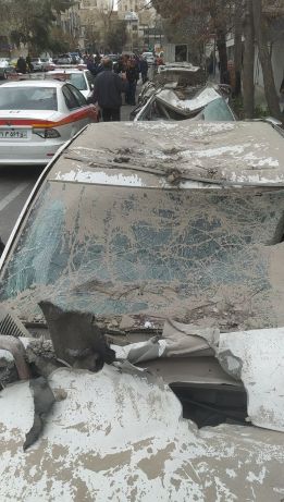 The condition of cars parked in front of a bombed building in Tehran(Photo: Alireza Bahrami)